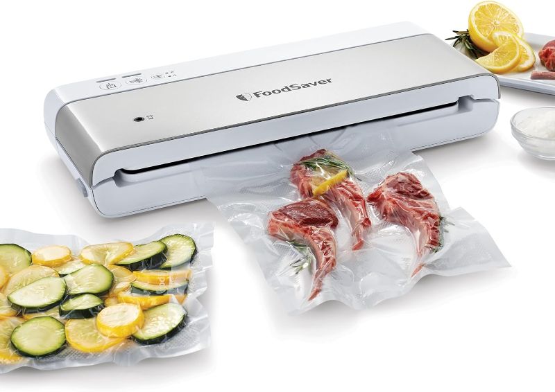 Photo 1 of FoodSaver Compact Vacuum Sealer Machine with Sealer Bags and Roll for Airtight Food Storage and Sous Vide, White
