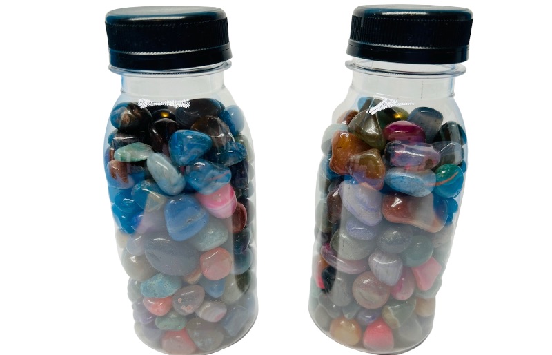 Photo 1 of 662534… 2 bottles of polished rocks 5” tall 