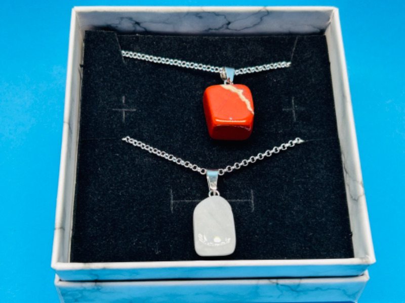 Photo 1 of 662559… 2 polished rock pendants on chains in gift box 