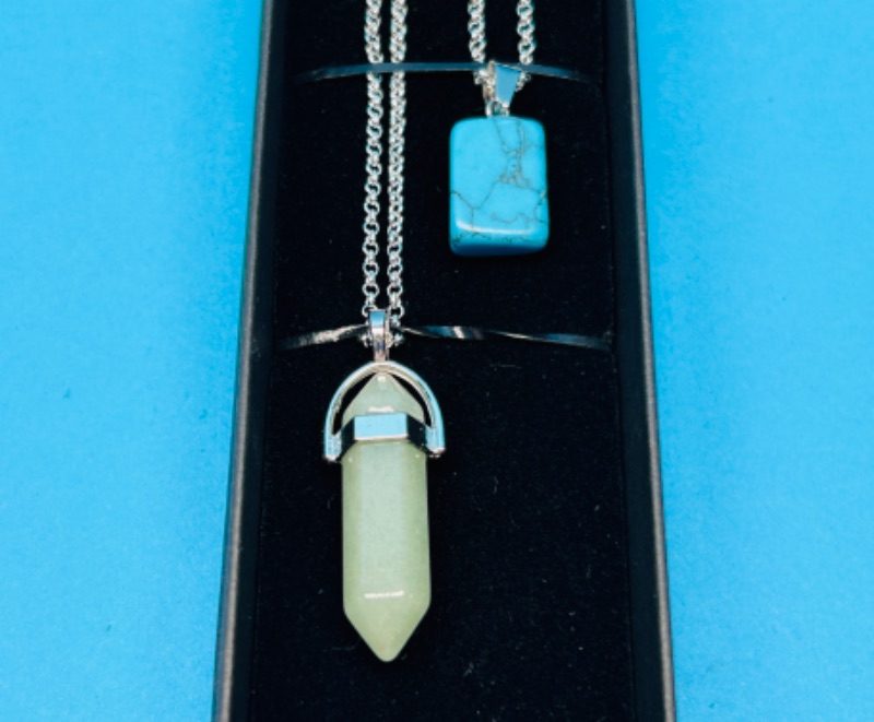 Photo 1 of 662561…  2 polished and crystal cut  rock pendants on chains in gift box 