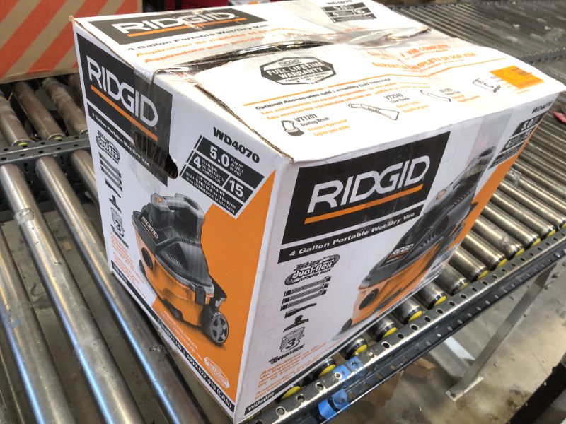 Photo 3 of RIDGID 4 Gallon 5.0 Peak HP Portable Wet/Dry Shop Vacuum with Fine Dust Filter, Locking Hose and Accessories, Oranges/Peaches
