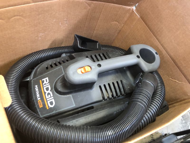 Photo 2 of RIDGID 4 Gallon 5.0 Peak HP Portable Wet/Dry Shop Vacuum with Fine Dust Filter, Locking Hose and Accessories, Oranges/Peaches
