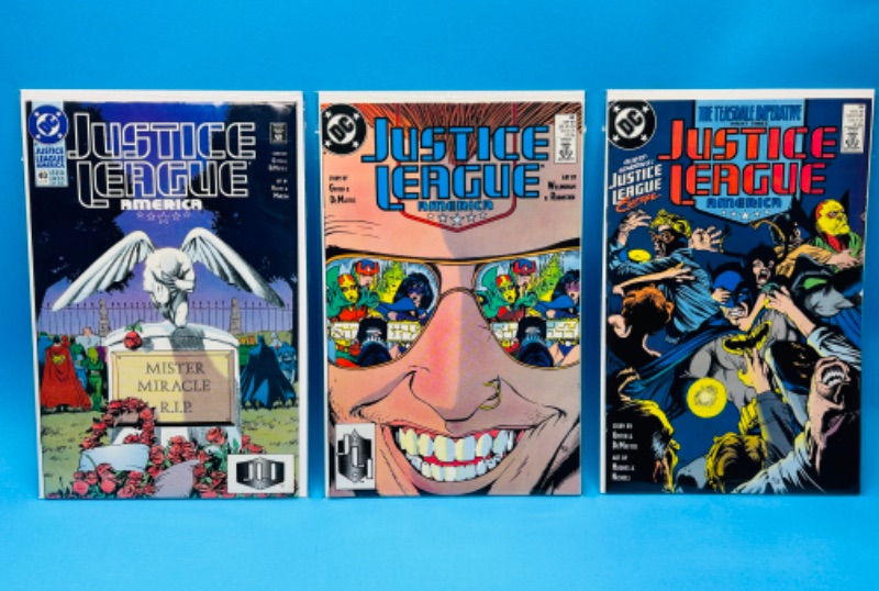 Photo 1 of 686054…3 older justice league  comics in plastic sleeves 