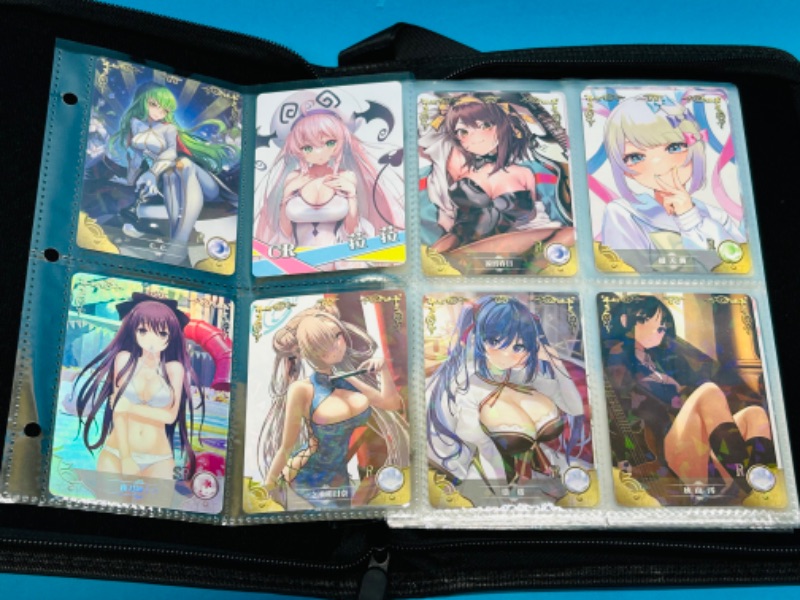 Photo 1 of 686487…68 Asian Anime cards in binder - some holo foil