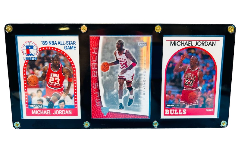 Photo 1 of 686550…3 Michael Jordan cards in display case