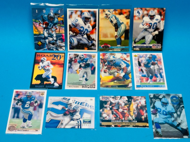 Photo 1 of 686570…12 Barry Sanders trading cards in plastic sleeves 