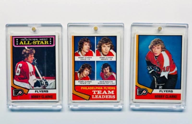 Photo 1 of 686574…3 vintage Bobby Clarke hockey cards in hard plastic cases 