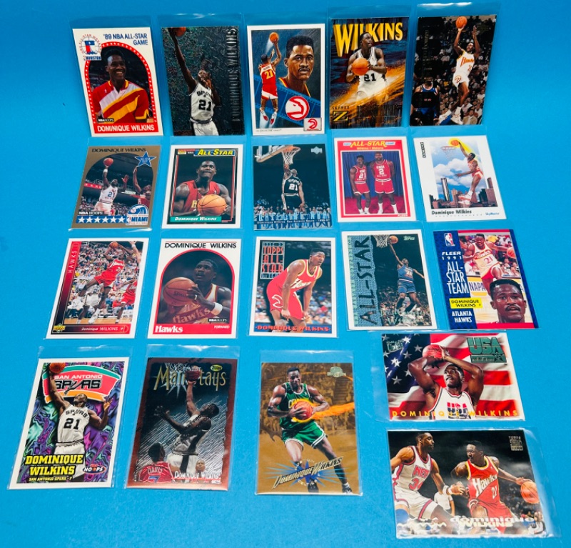 Photo 1 of 686587…20 Dominique Wilkins trading cards and plastic sleeves