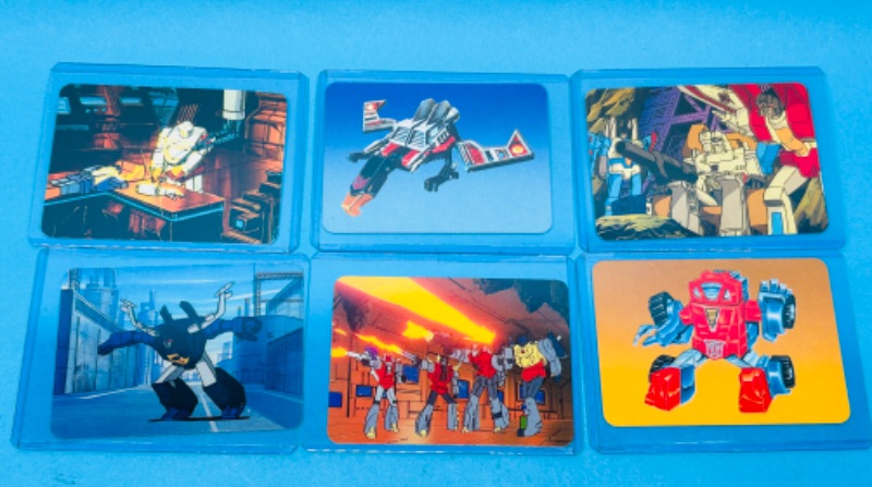 Photo 1 of 686663…6. 1985 transformers series 1 cards in hard plastic sleeves 