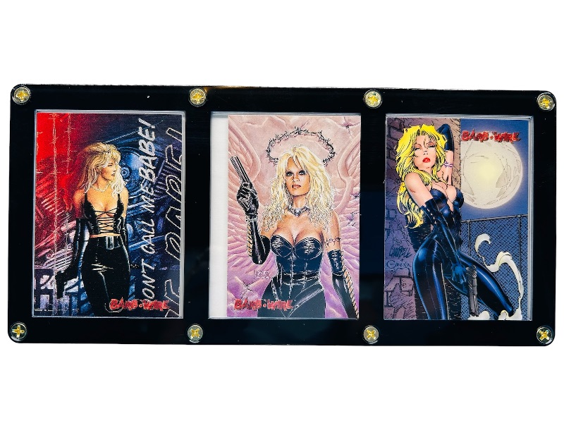 Photo 1 of 686667…  3 Pam Anderson Barb Wire cards in display case 