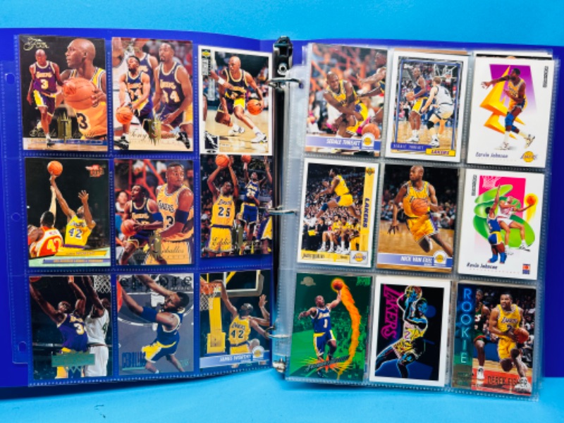 Photo 1 of 686669…90 mixed Lakers basketball team cards in binder 