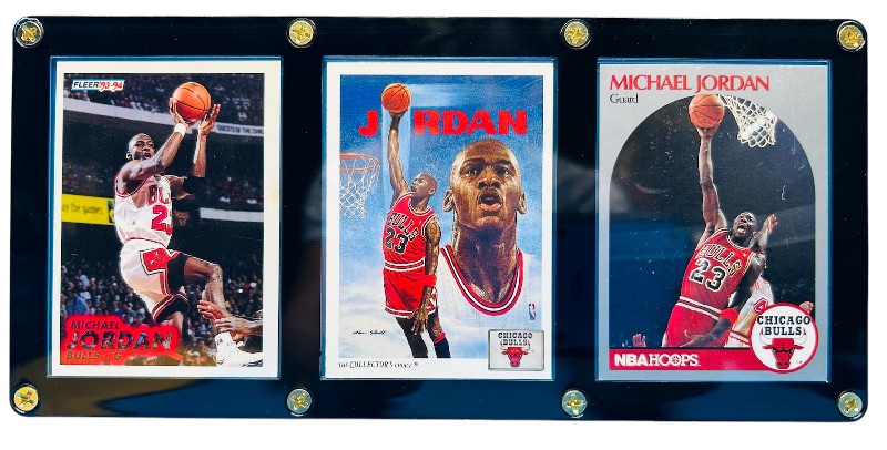 Photo 1 of 686675…3 Michael Jordan cards in display case