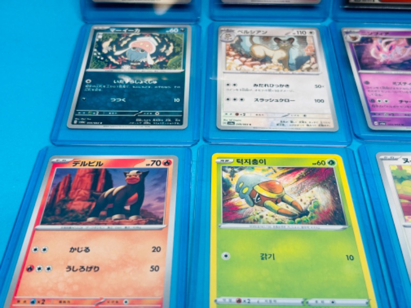 Photo 2 of 686683…12 Pokémon Japan/Asian cards in hard plastic sleeves 