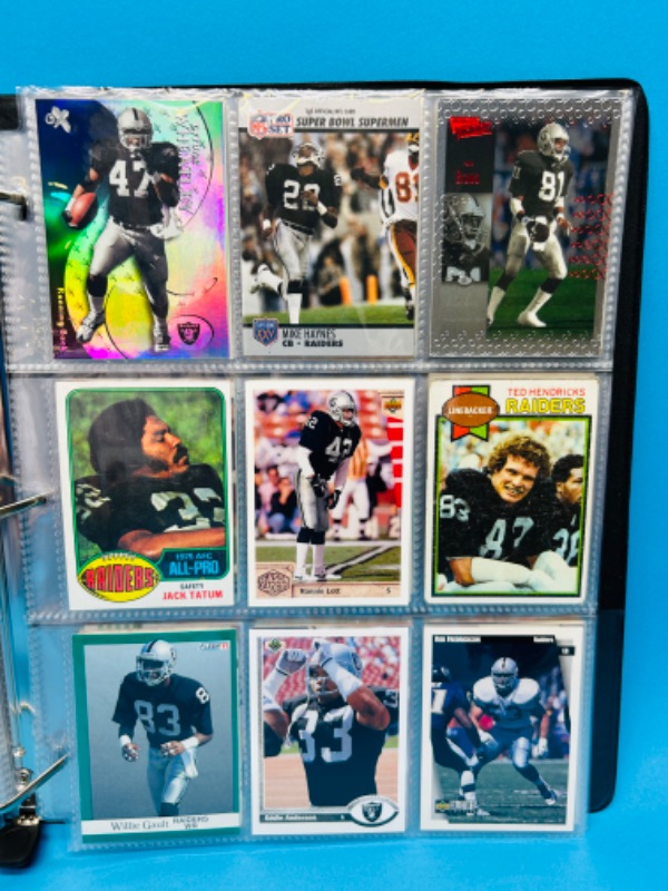 Photo 9 of 686703…153 mixed Raiders football cards in binder 