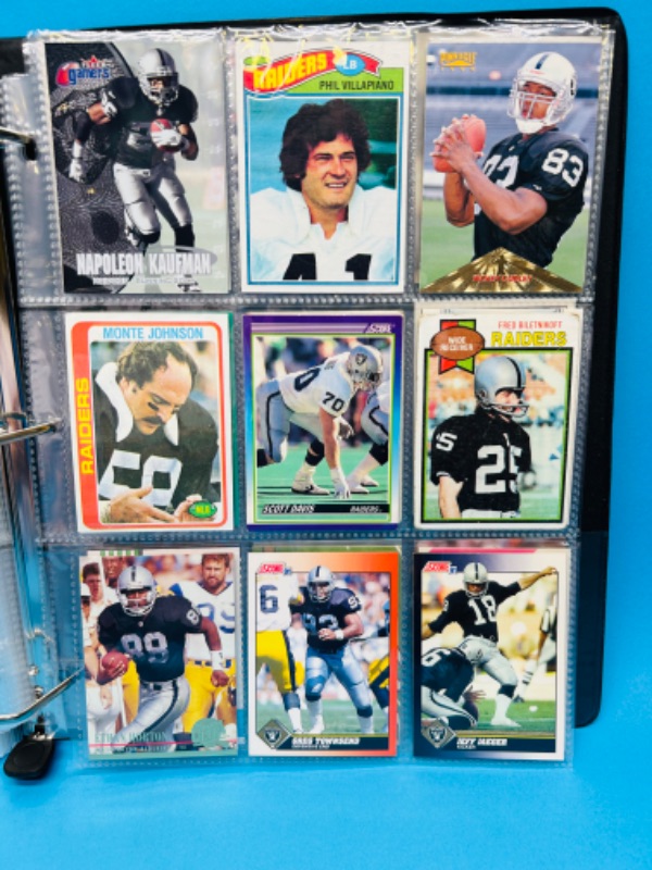 Photo 1 of 686703…153 mixed Raiders football cards in binder 
