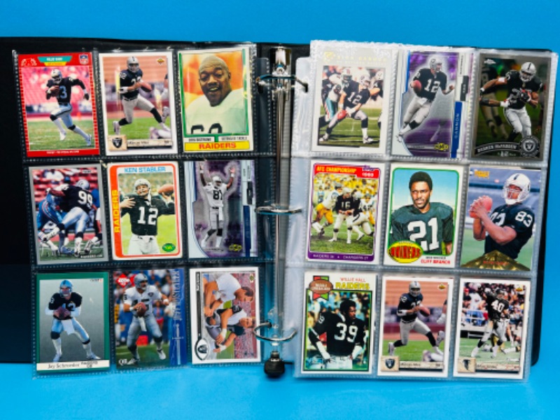 Photo 1 of 686703…153 mixed Raiders football cards in binder 