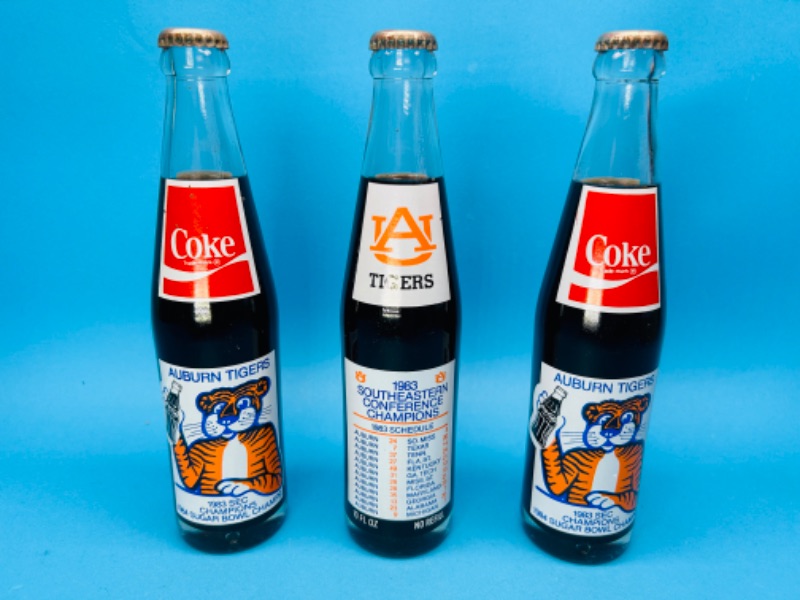 Photo 1 of 686717… 3 vintage Coke Auburn Tigers 1983 SEC and 1984 sugar bowl champs bottles -still full 