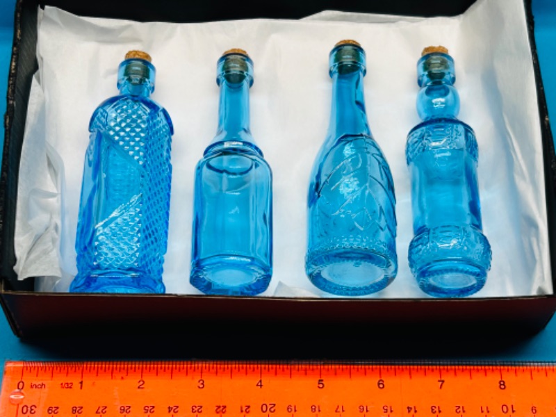 Photo 1 of 686924…4 blue glass decorative bottles 5”