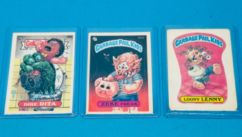 Photo 1 of 686930…3 vintage 1985-87 garbage pail kids sticker cards in hard plastic sleeves 