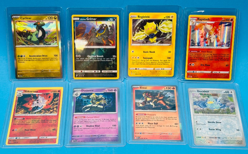 Photo 1 of 686973…8 Pokémon reverse holo and holo cards in hard plastic cases 