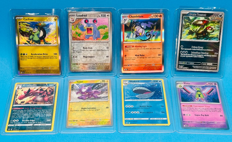 Photo 1 of 686977… 8 Pokémon reverse holo and holo cards in hard plastic cases 