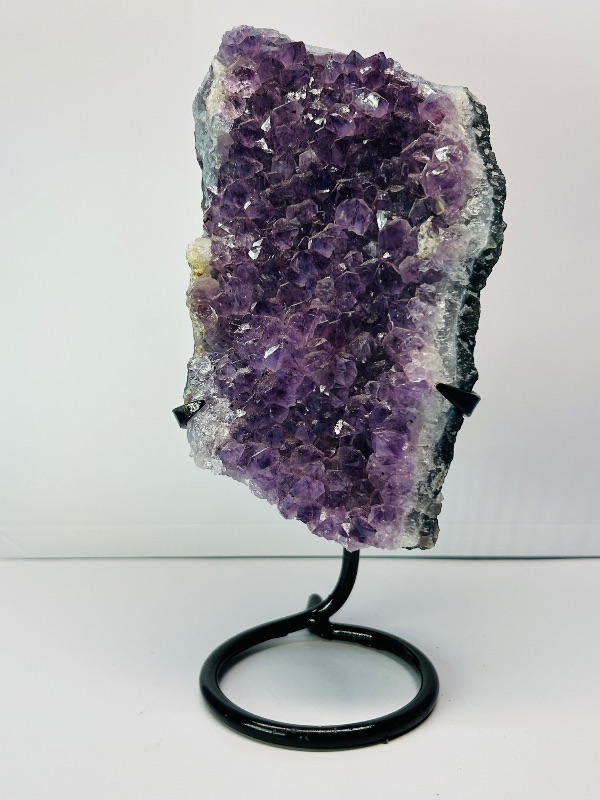 Photo 3 of 687032…  9” amethyst crystal rock on stand- height includes display stand 