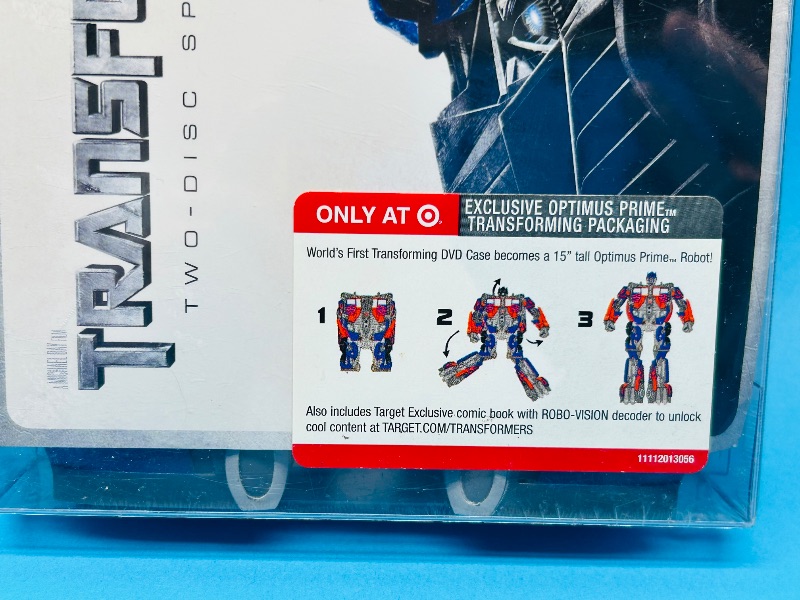 Photo 3 of 687065…sealed Transformers DVDs and Optimus Prime transforming package