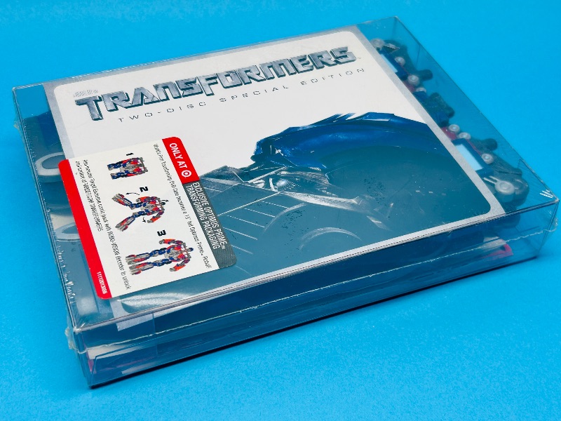 Photo 1 of 687065…sealed Transformers DVDs and Optimus Prime transforming package