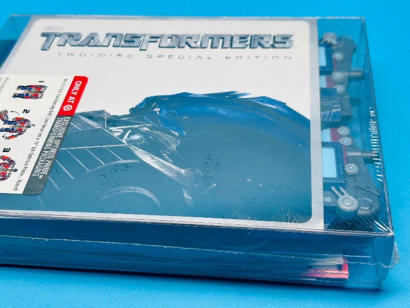 Photo 2 of 687065…sealed Transformers DVDs and Optimus Prime transforming package