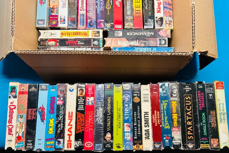 Photo 2 of 687124… final sale no returns/refunds- 40 VHS movie tapes -cases show wear from age