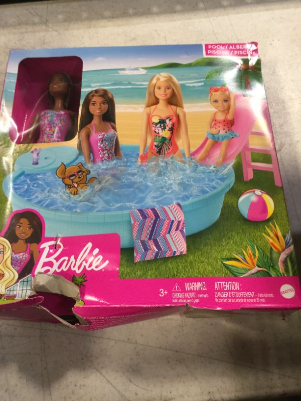 Photo 2 of Barbie Doll and Pool Playset with Pink Slide, Beverage Accessories and Towel, Brunette Doll in Floral Swimsuit Multi