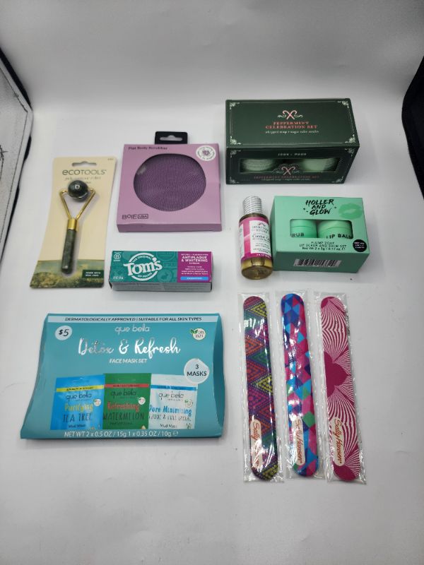 Photo 1 of Beauty Enhancing Products - 1 Jade Roller 3 Pack Sheet Masks 1 Caster Oil 1 Silicone Face Scrubby 1 Travel Toothpaste 1 Two Pack Lip Balms 3 Set Nail Files 1 Pack Body Lotion & Scrub New