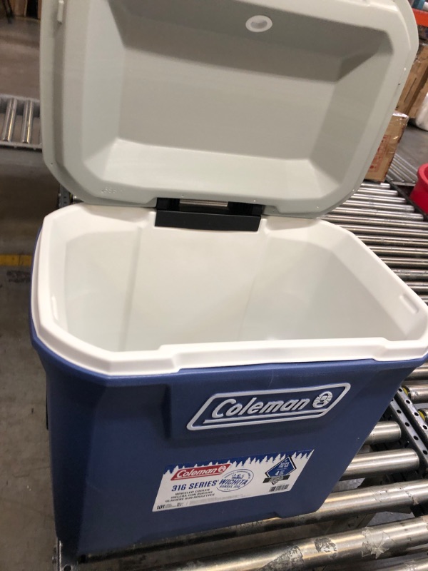 Photo 2 of Coleman 316 Series Insulated Portable Cooler with Heavy Duty Wheels, Leak-Proof Wheeled Cooler with 100+ Can Capacity, Keeps Ice for up to 5 Days Twilight 65qt Coolers