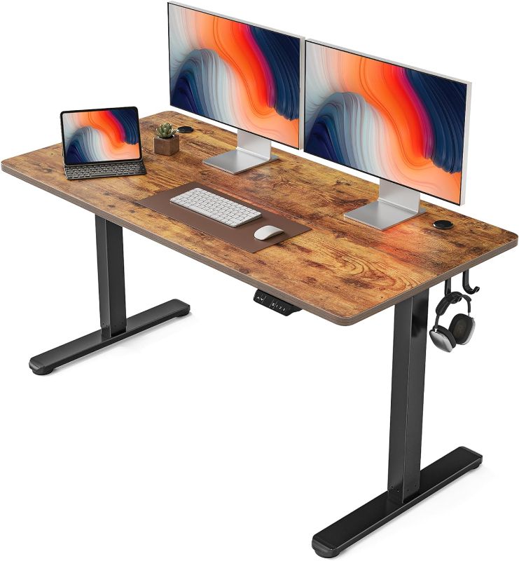 Photo 1 of FEZIBO Height Adjustable Electric Standing Desk, 55 x 24 Inches Stand up Table, Sit Stand Home Office Desk with Splice Board, Black Frame/Rustic Brown Top
