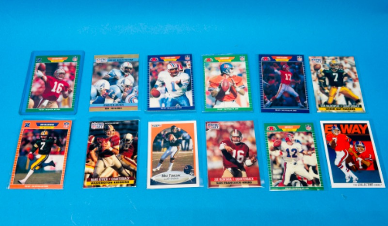 Photo 1 of 698579…12 quarterback trading cards in sleeves 