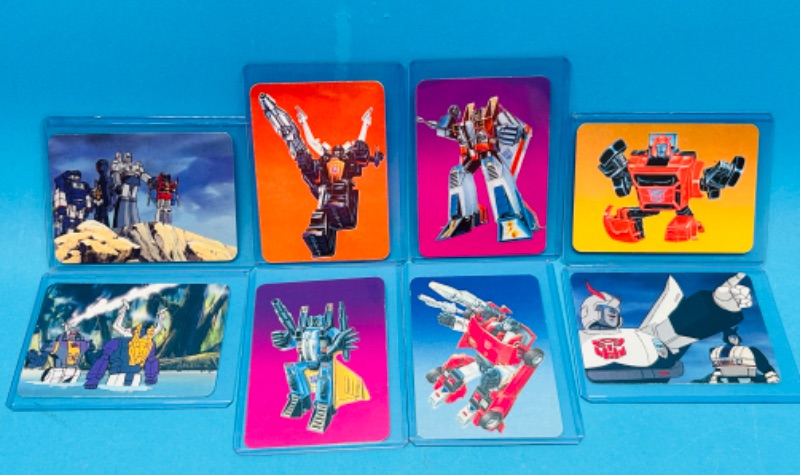 Photo 1 of 698642…8 1985 Transformers series 1 cards in hard plastic sleeves 