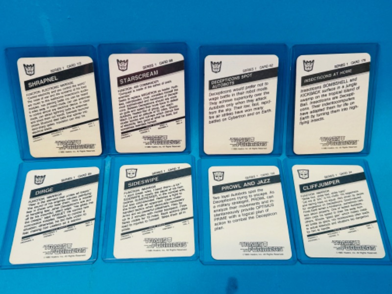 Photo 2 of 698642…8 1985 Transformers series 1 cards in hard plastic sleeves 