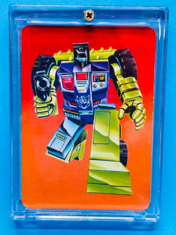 Photo 1 of 698674…1985 Transformers Scrapper card 121 series 1  in hard plastic case