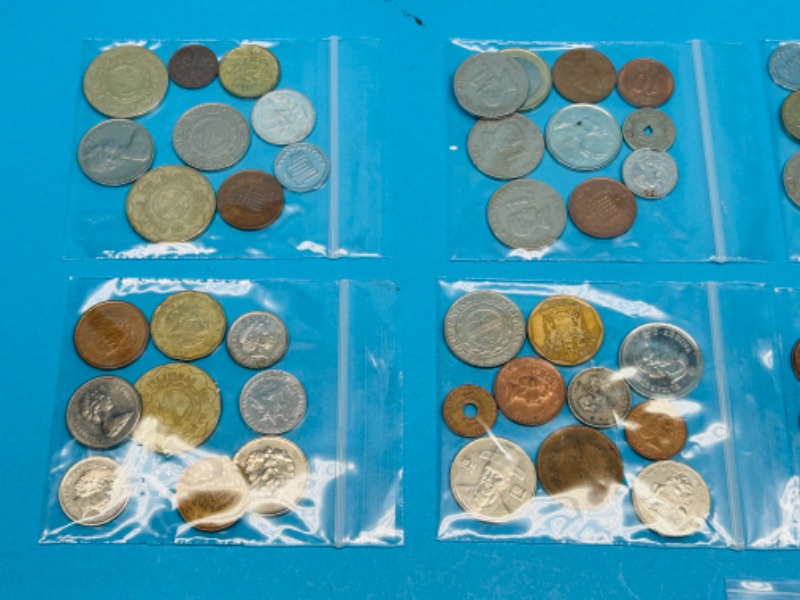 Photo 8 of 698712…circulated foreign and U.S. coins and 2 stamps 22k gold