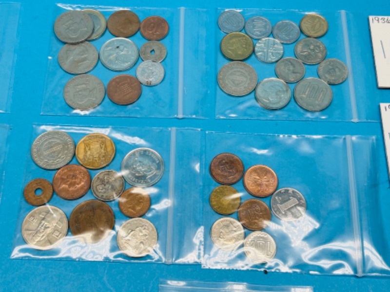 Photo 7 of 698712…circulated foreign and U.S. coins and 2 stamps 22k gold