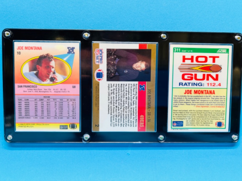 Photo 2 of 698784…3 collectible Joe Montana cards in display case