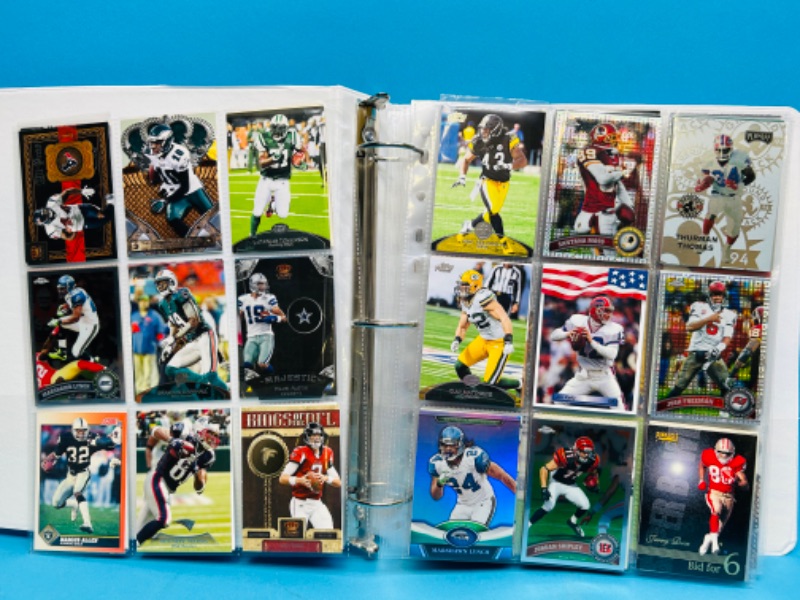 Photo 1 of 698786…306 mixed football trading cards in binder- several refractor cards