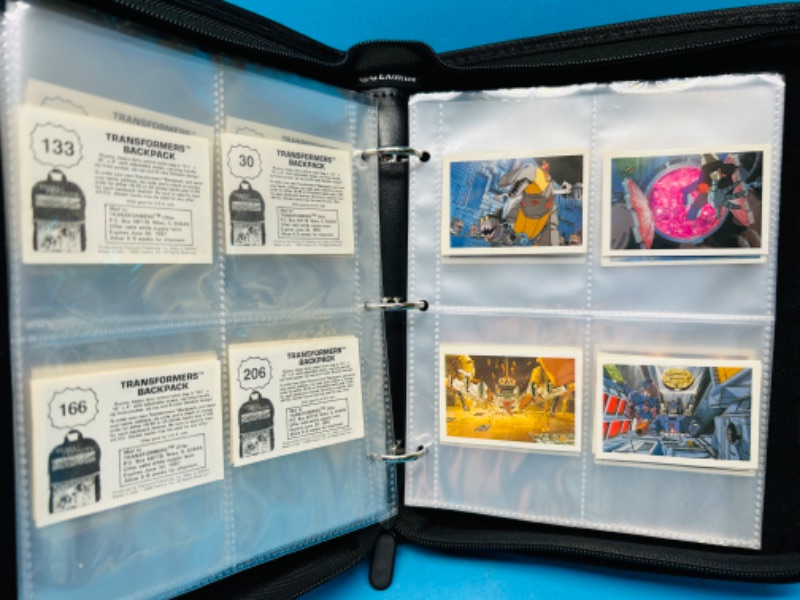 Photo 1 of 698810…74 vintage 1986 Transformers backpack stickers in binder - a few doubles 