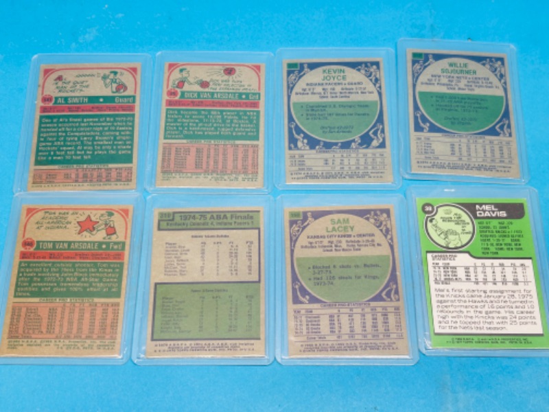 Photo 1 of 698817… 8 vintage basketball cards from the mid 1970’s in hard plastic sleeves 
