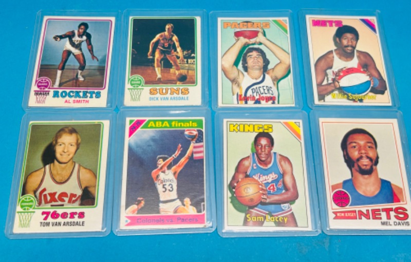 Photo 1 of 698817… 8 vintage basketball cards from the mid 1970’s in hard plastic sleeves 