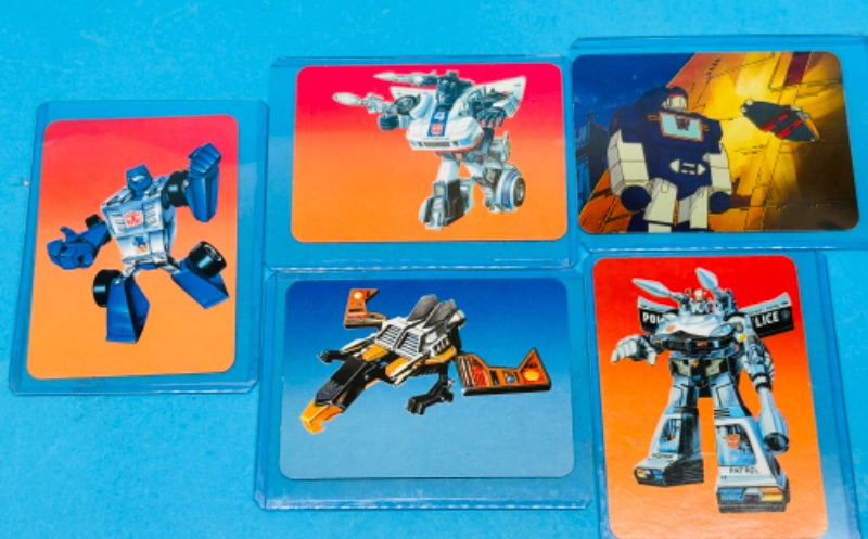 Photo 1 of 698821…5 vintage 1985 transformers series 1 cards in hard plastic sleeves 