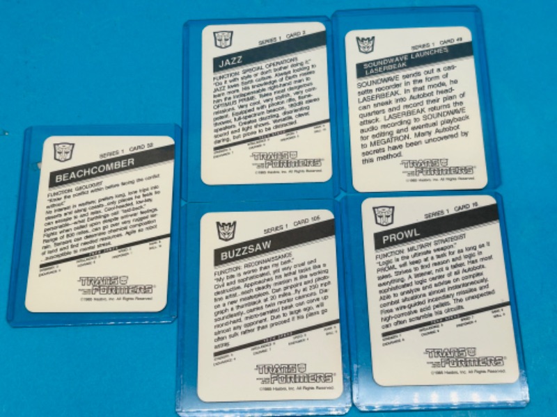 Photo 2 of 698821…5 vintage 1985 transformers series 1 cards in hard plastic sleeves 