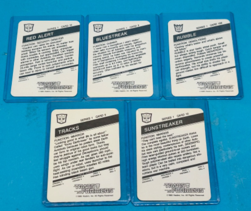 Photo 2 of 698824…5 vintage 1985 transformers series 1 cards in hard plastic sleeves 