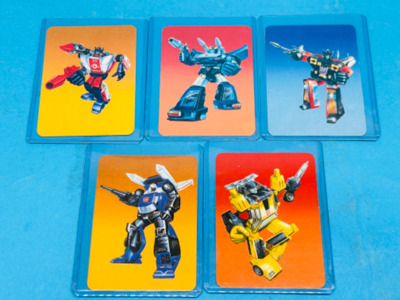 Photo 1 of 698824…5 vintage 1985 transformers series 1 cards in hard plastic sleeves 