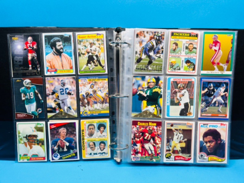 Photo 1 of 698869…306 mixed football trading cards in binder 